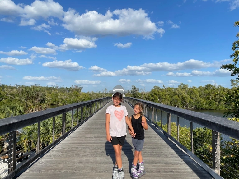 kids rollerblading through greenway baker park, naples florida